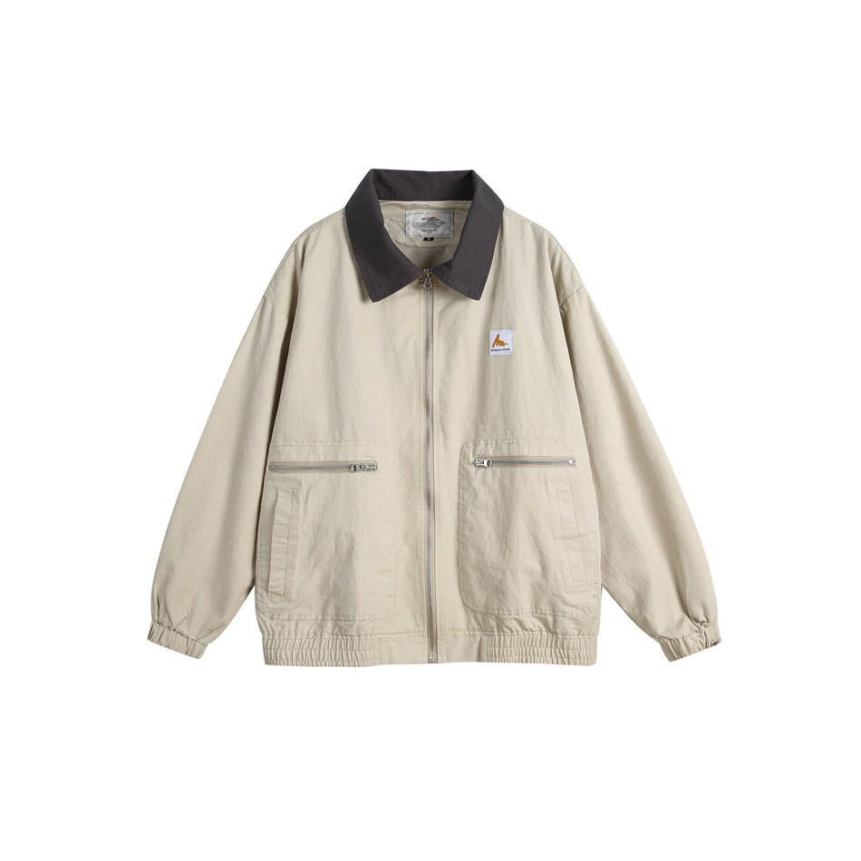 Khaki zip-front jacket with dark gray collar, two zippered patch pockets and elastic cuffs and hem, flat view