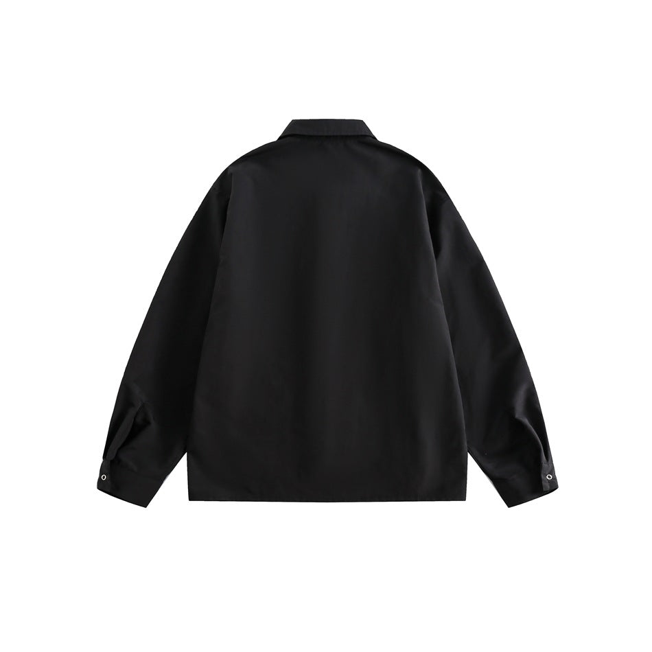Back view of a black long-sleeved collared shirt displayed flat against a white background.