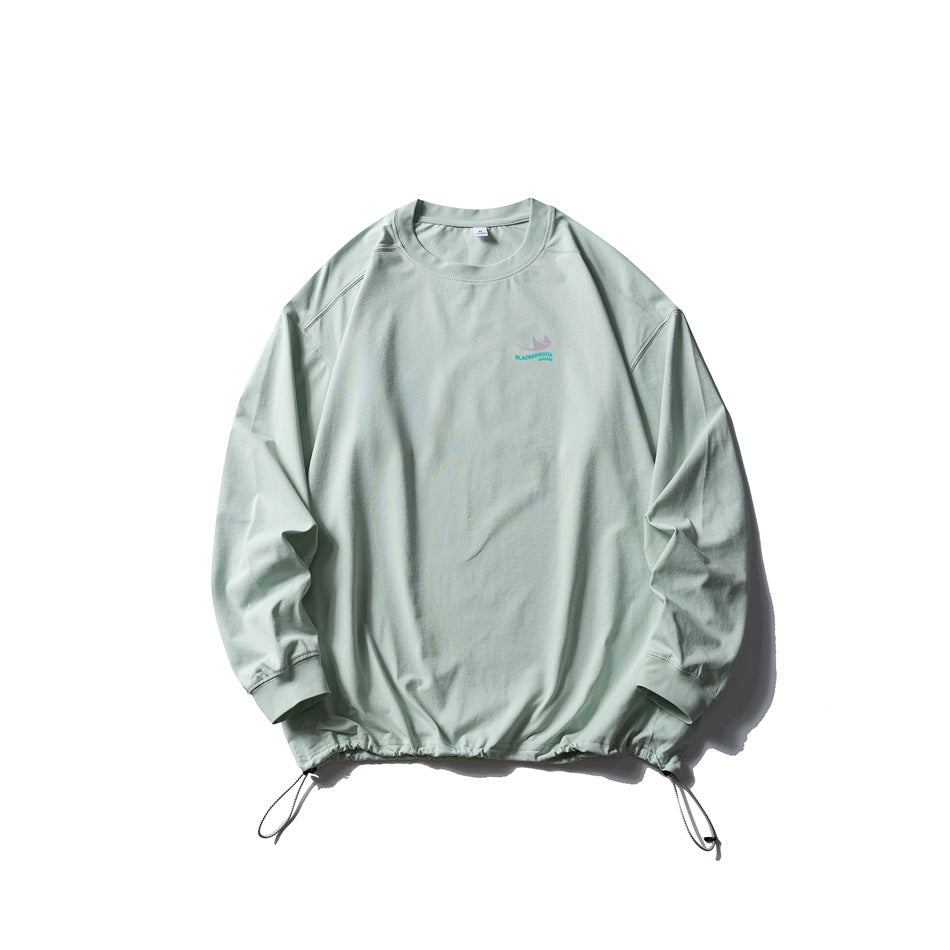 Pale mint green long-sleeve crew-neck top flat lay with drawstring hem and small chest print