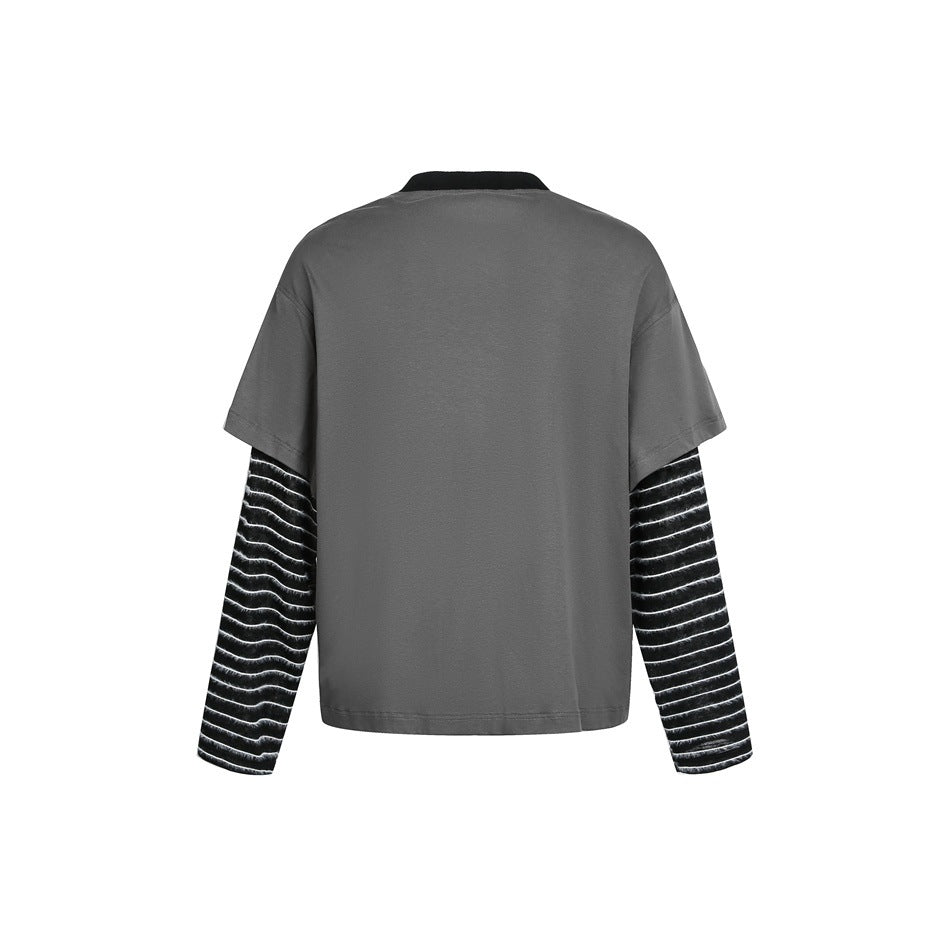 Back view of a gray short-sleeve top layered over black sleeves with thin white stripes.