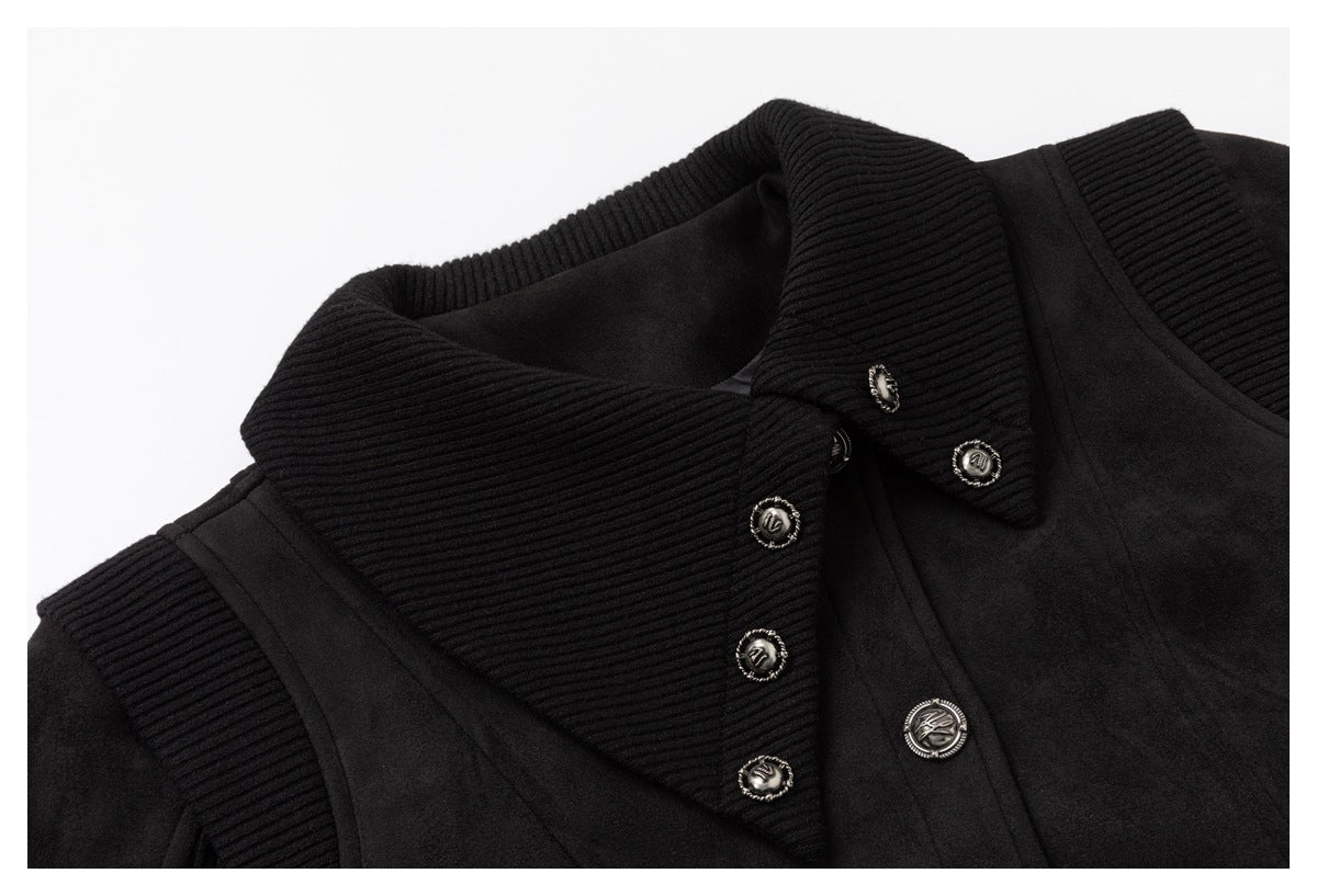 Close-up of the black jacket's ribbed collar and lapel with ornate silver buttons.