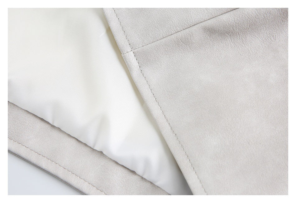 Close-up showing the pale garment's white lining and stitched interior seam.