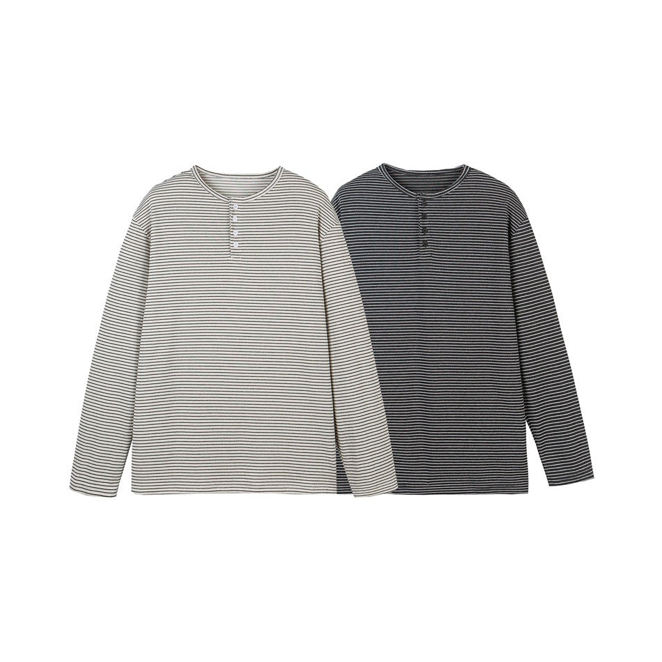 Two front-facing long-sleeve striped henleys, one cream and one black, shown side by side.