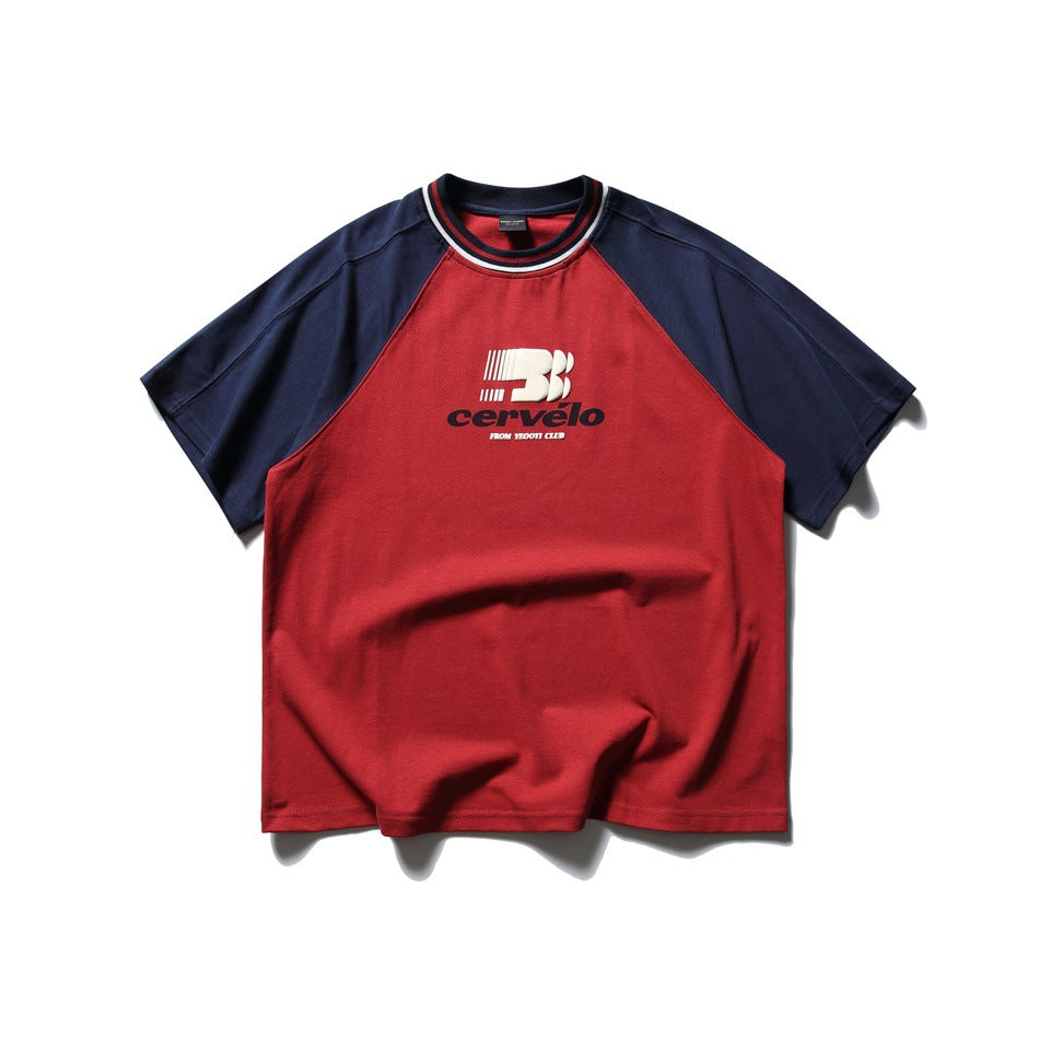 Red short-sleeve T-shirt with navy raglan sleeves, striped collar and chest graphic print, flat lay front view