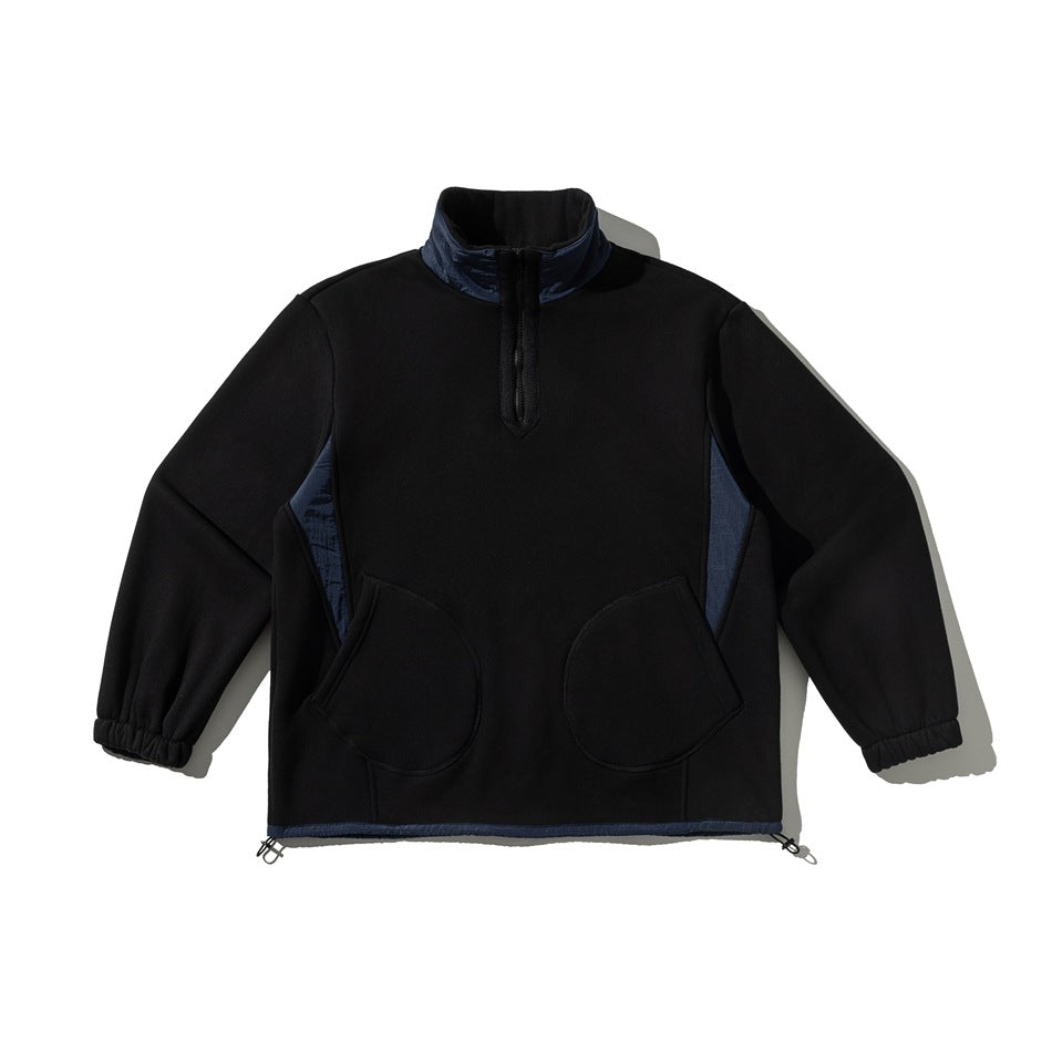 Black half-zip pullover sweatshirt with navy collar and side panels, two round front pockets and elastic cuffs