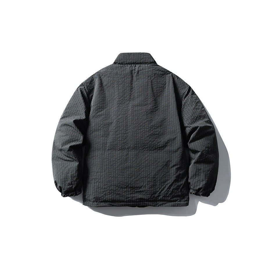 Back view of a gray-and-black micro-check jacket with a high collar and elasticated cuffs.