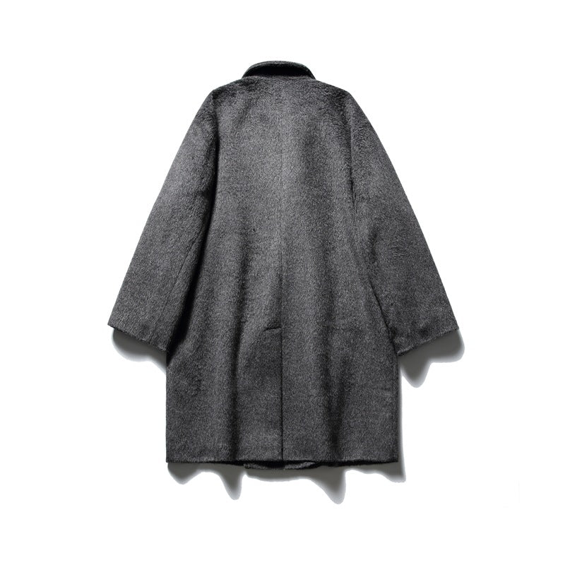 Full back view of a dark charcoal gray textured coat with a center seam and long sleeves.