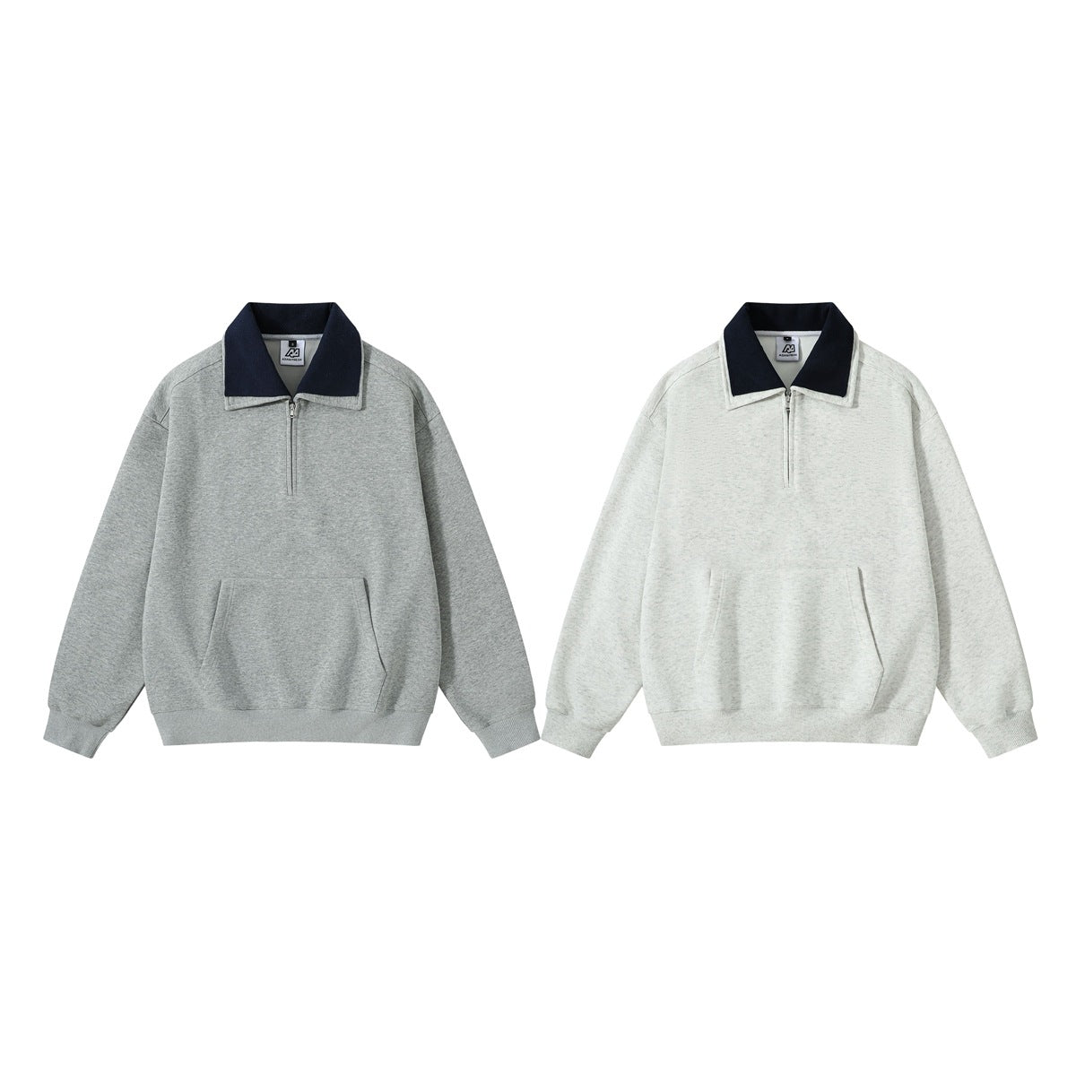 Front views of two pullover tops: gray and light gray, each with a navy collar, short zipper, and kangaroo pocket.