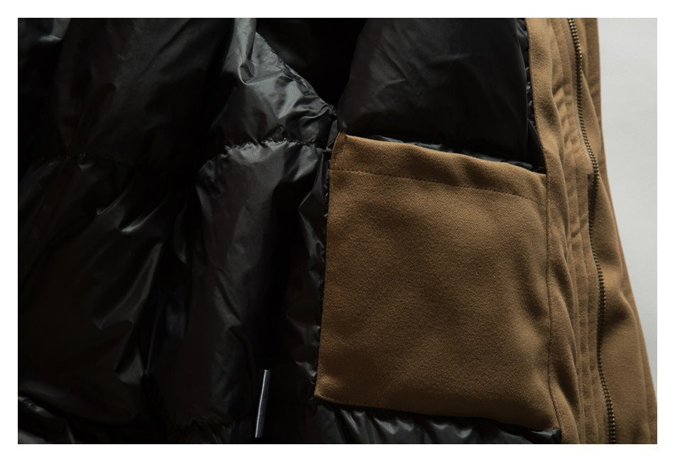 Close-up of the brown jacket's interior pocket beside its black quilted lining and zipper.