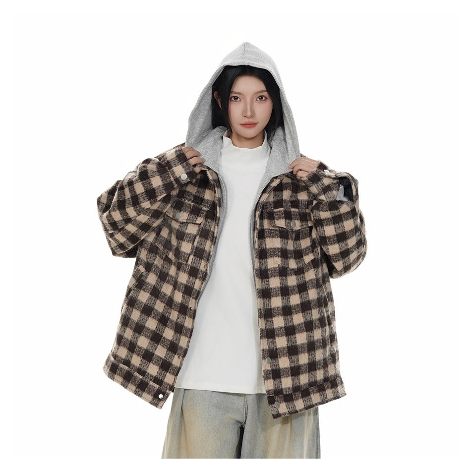 Model wearing a brown-and-black plaid hooded jacket, shown from the waist up with the jacket open.
