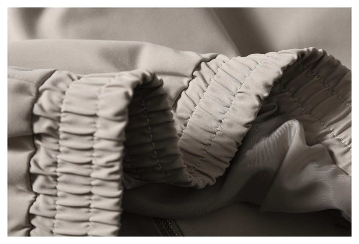 Close-up of the jacket’s gathered elastic cuff and sleeve lining.