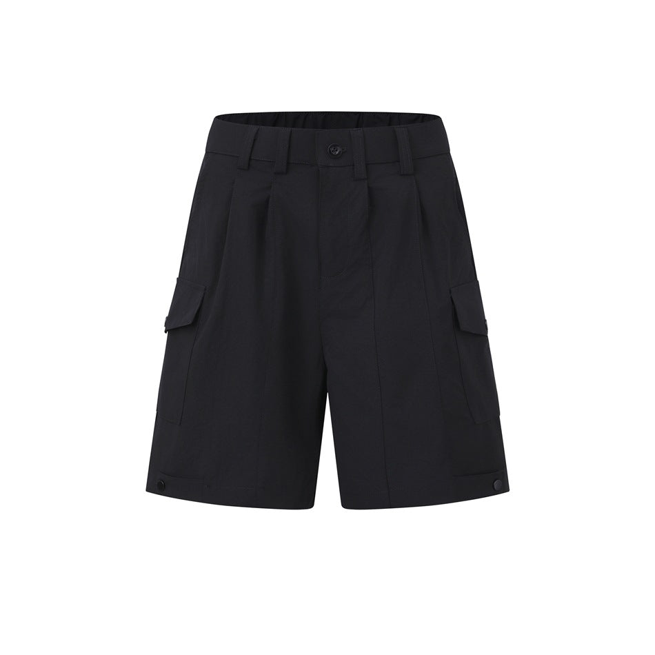Black pleated cargo shorts with side flap pockets, belt loops, button closure and snap tabs at the hems, front view