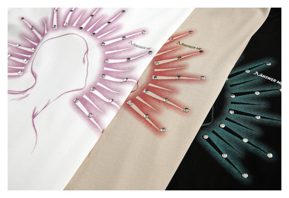 White, beige, and black tops with radiating graphic designs and small metal studs.