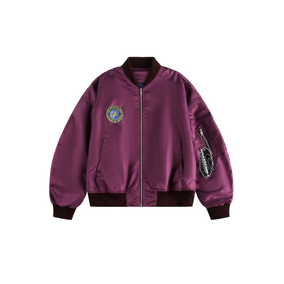 Purple bomber jacket flat lay with burgundy ribbed collar, cuffs and hem, chest patch and sleeve zip pocket