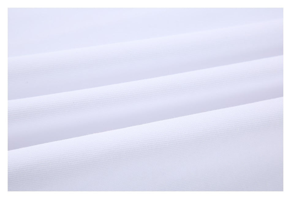 Close-up of white fabric arranged in parallel folds, showing its fine surface texture.