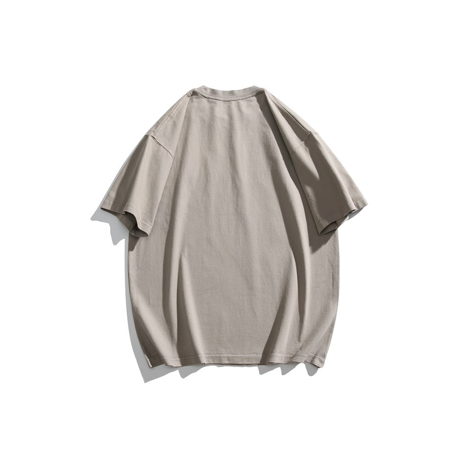 Back view of a plain oversized taupe-gray T-shirt with short sleeves, displayed against a white background.