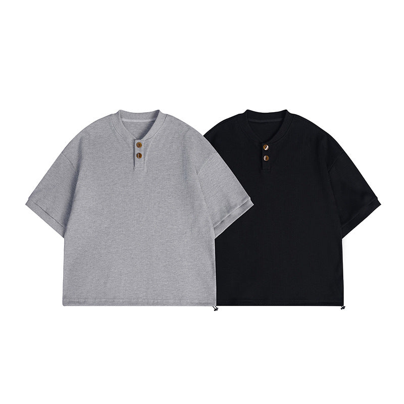Gray and black short-sleeve ribbed Henley shirts with round necklines, two buttons, and hem toggles.