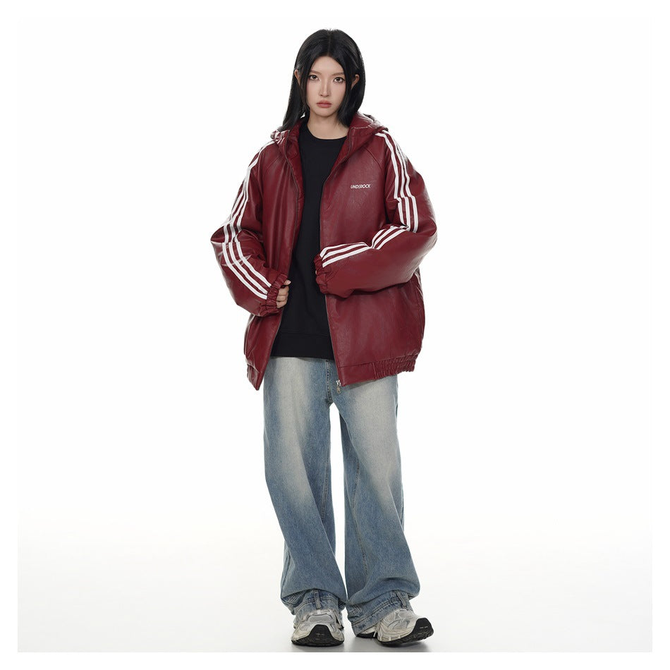 Model wearing an open burgundy hooded zip jacket with white sleeve stripes over a black top.