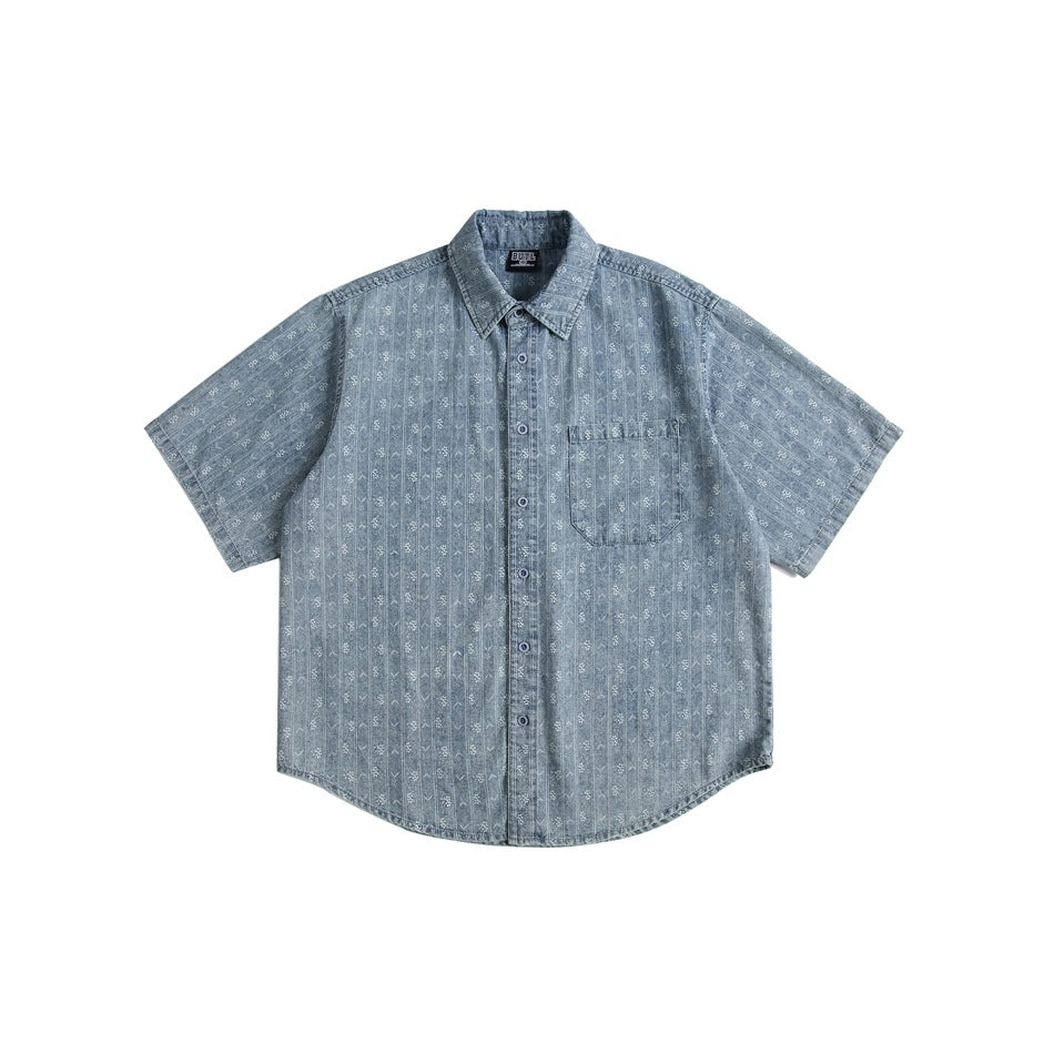 Denim-blue short-sleeve button-up shirt with white stripe and motif pattern, chest pocket, flat lay front view