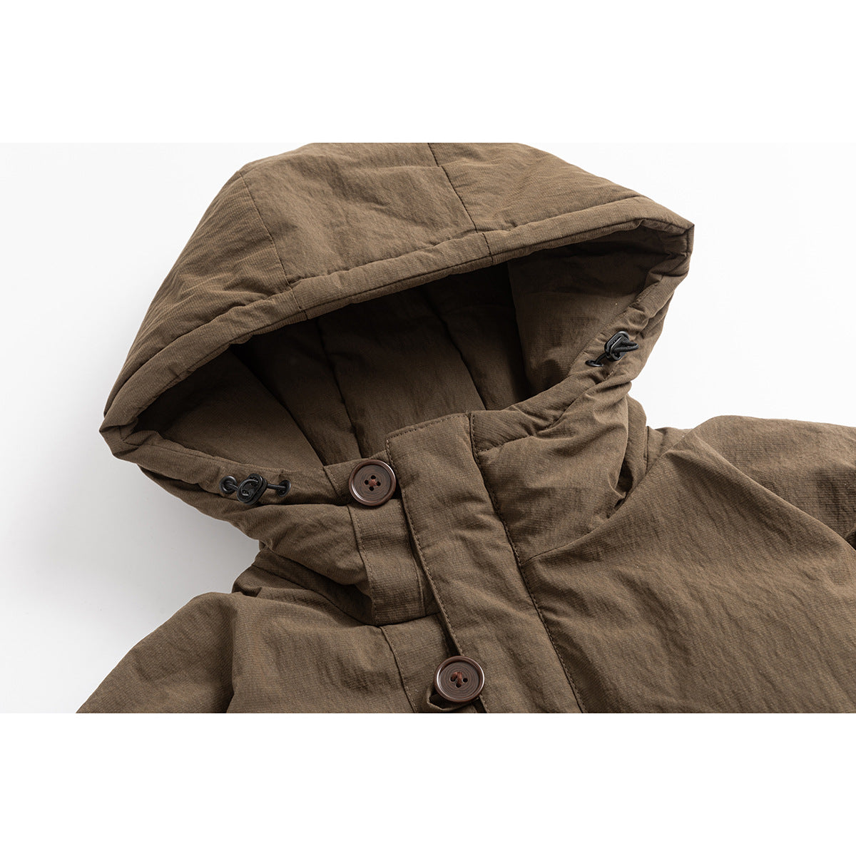 Close-up of a brown hooded jacket showing the lined hood, drawcord toggles, and large front buttons.