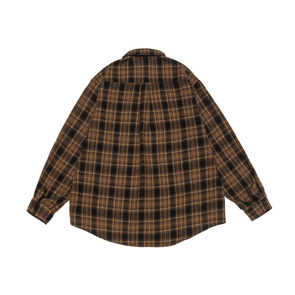 Back view of a brown and black plaid long-sleeve button-up shirt with a pointed yoke and curved hem.