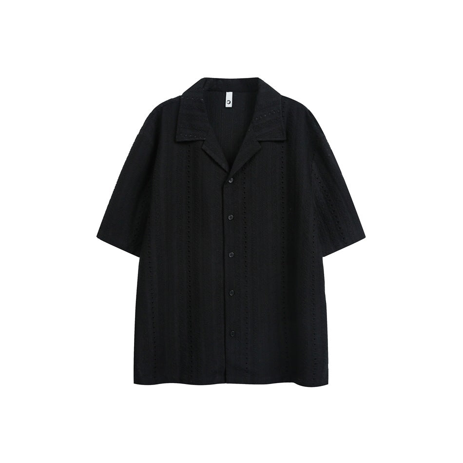 Black short-sleeve camp-collar shirt with button front and vertical eyelet stripe texture, flat lay