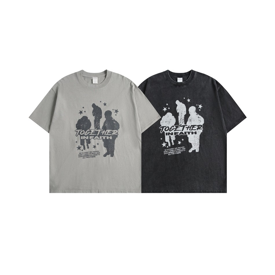 Two short-sleeve graphic T-shirts shown from the front in gray and charcoal, with contrasting figure and star prints.