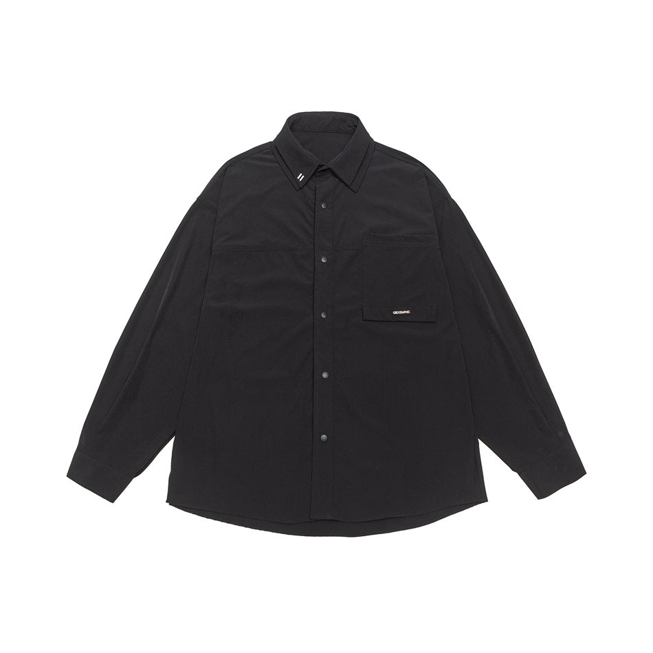 Black long-sleeve snap-button shirt with double collar and large flap chest pocket, flat lay front view