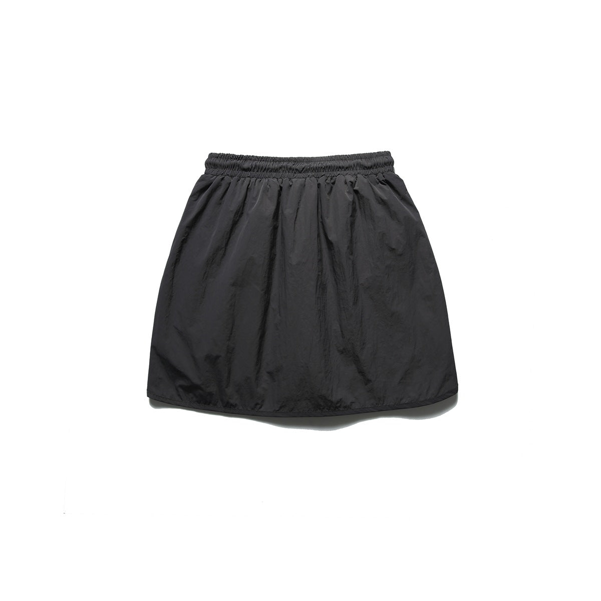 Back view of a plain black skirt with a gathered elastic waistband.
