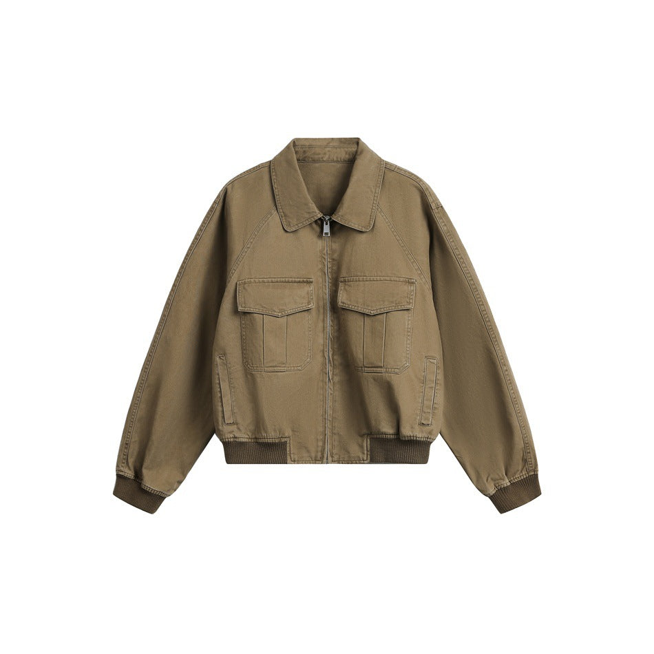 Brown cropped zip jacket with pointed collar, two flap chest pockets and ribbed cuffs and hem, flat lay