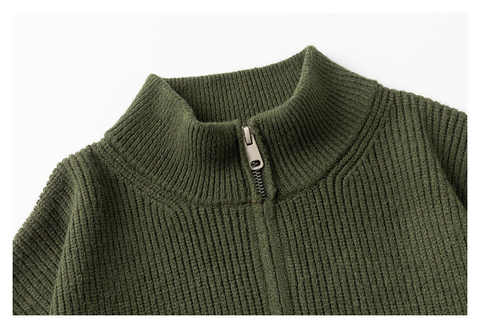 Close-up of an olive rib-knit sweater's stand collar and short front zipper.