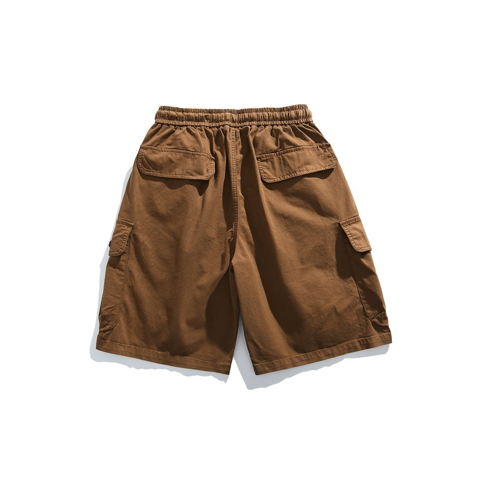 Back view of brown cargo shorts with an elastic waist, two rear flap pockets, and side cargo pockets.