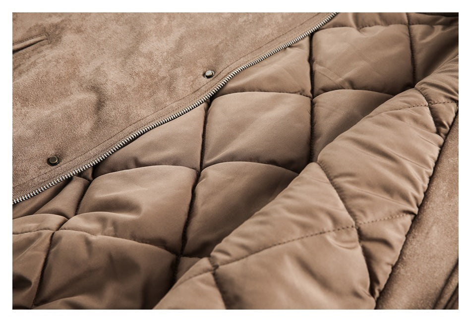Close-up of a brown jacket opened to show its quilted lining, zipper, and snap-button placket.