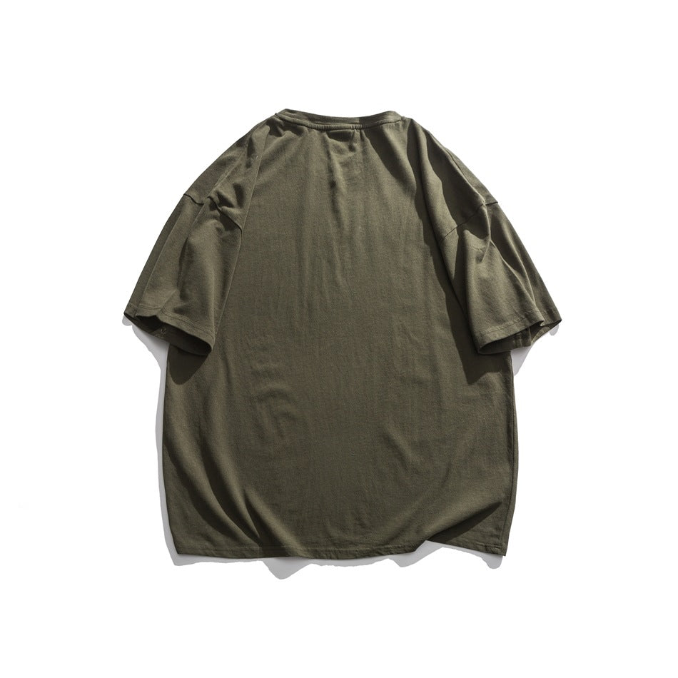 Back view of a plain olive green oversized short-sleeve T-shirt laid flat.