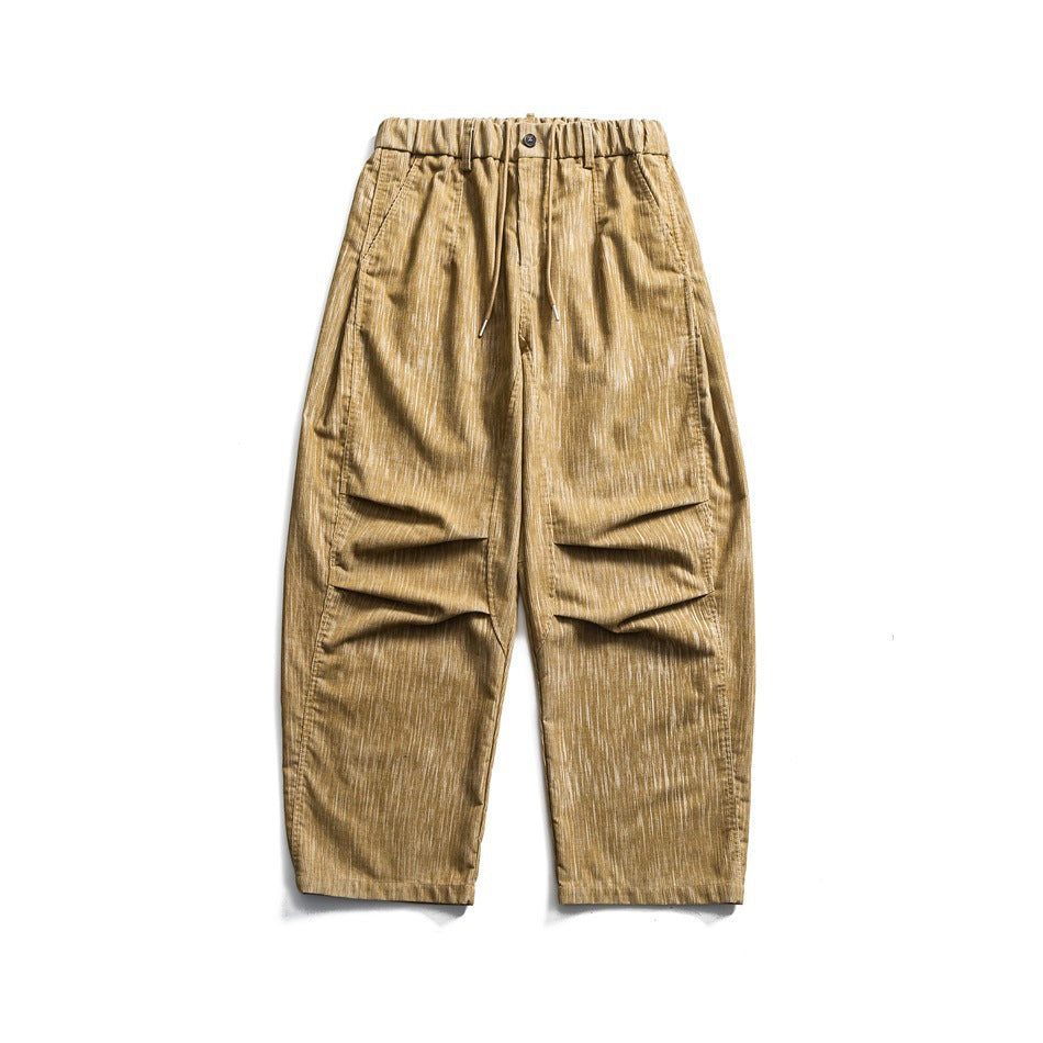Khaki wide-leg drawstring pants with elastic waist, knee pleats and streaky textured fabric, flat lay front view