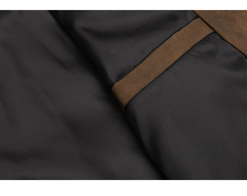 Close-up of the jacket's dark lining and a narrow brown textured trim panel.