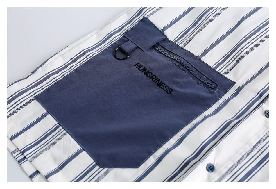 Navy zip pocket with a metal D-ring and HUNGRINESS embroidery on a white striped shirt.