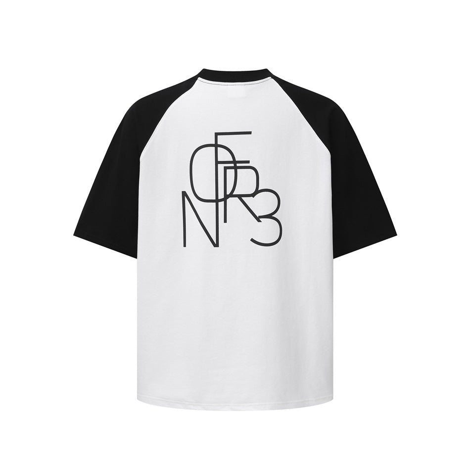 Back of a white raglan T-shirt with black sleeves and collar and a large black line-art letter graphic