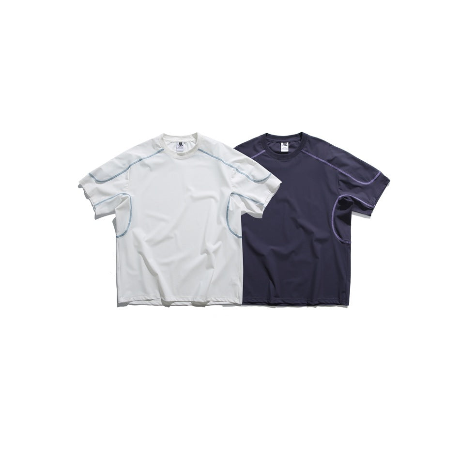 Two short-sleeve crew-neck shirts shown from the front: one white with pale blue seams and one dark navy with purple seams.
