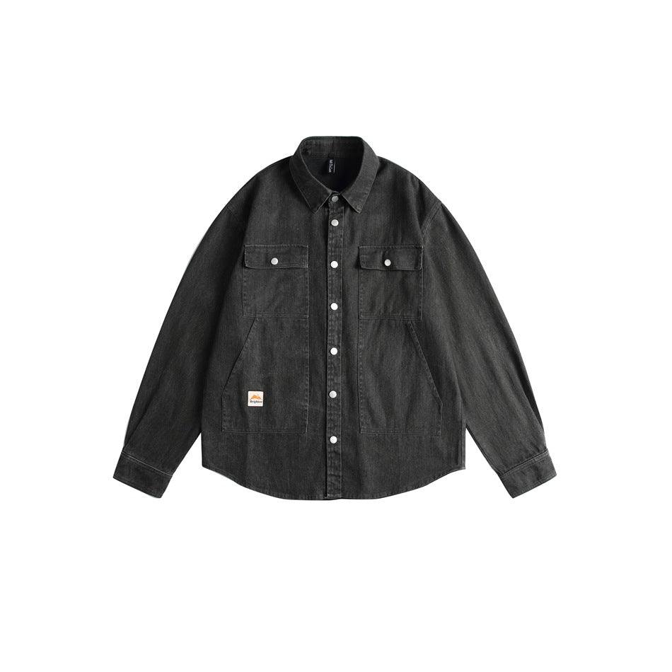 Washed black long-sleeve button-front shirt with flap chest pockets and large lower pockets, flat lay front view