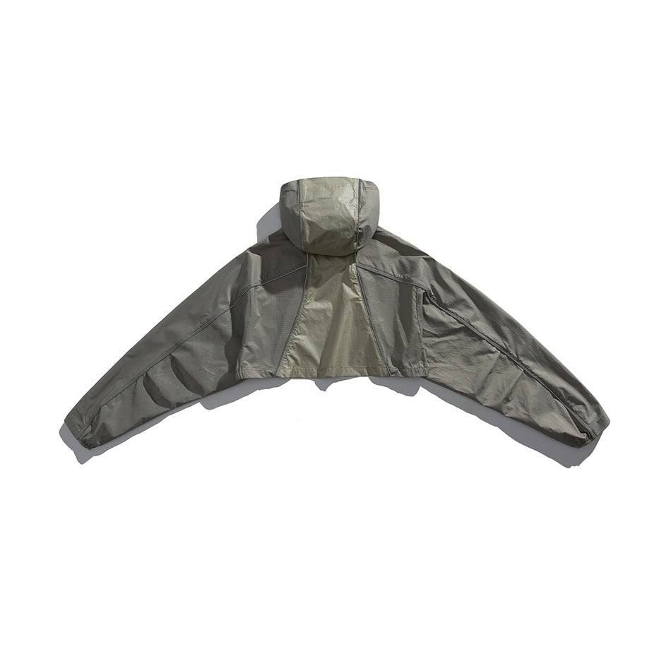 Back view of a gray-green hooded jacket with a paneled back and long sleeves spread outward.