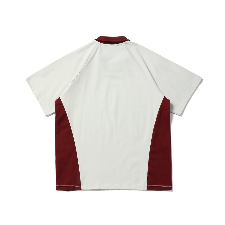 Back view of a short-sleeve color-block shirt with a white body and burgundy collar and side panels.