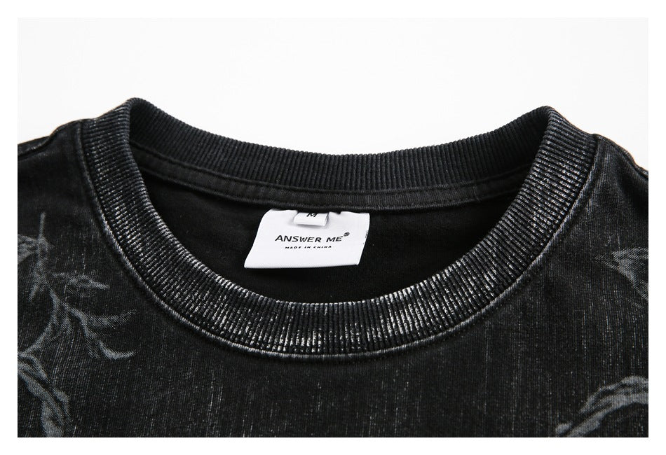 Close-up of a black ribbed crew neckline with a visible white inner label.