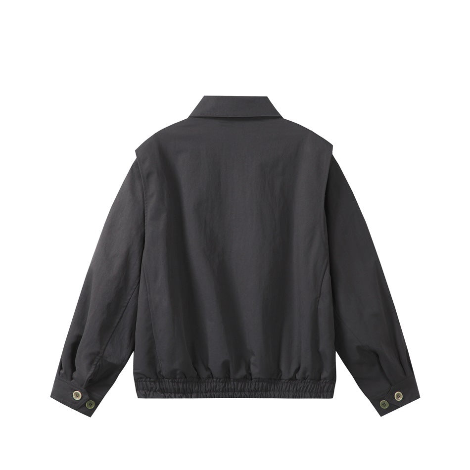 Back view of a charcoal collared jacket with long sleeves, buttoned cuffs, and a gathered hem.