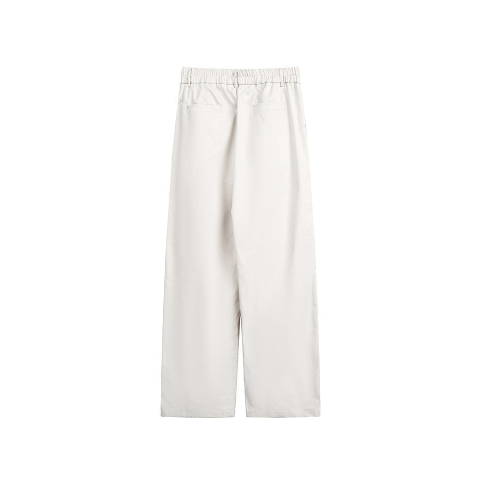White wide-leg trousers shown from the back, with an elastic waistband and two welt pockets.