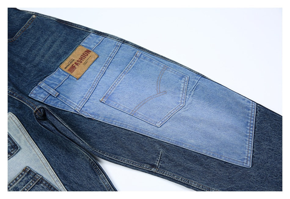 Close-up of jeans with contrasting dark and light blue denim panels and a rear pocket.