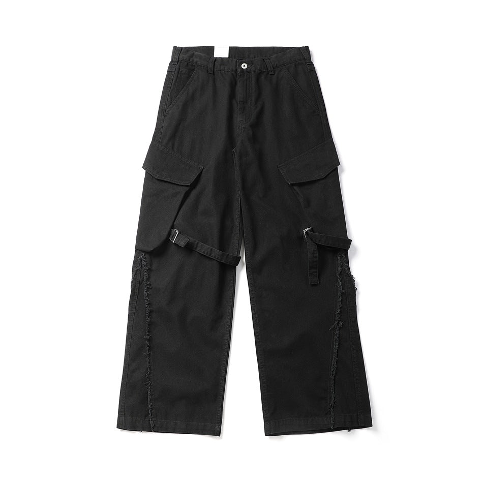 Black wide-leg cargo pants with flap pockets, knee straps and frayed leg seams, front flat lay