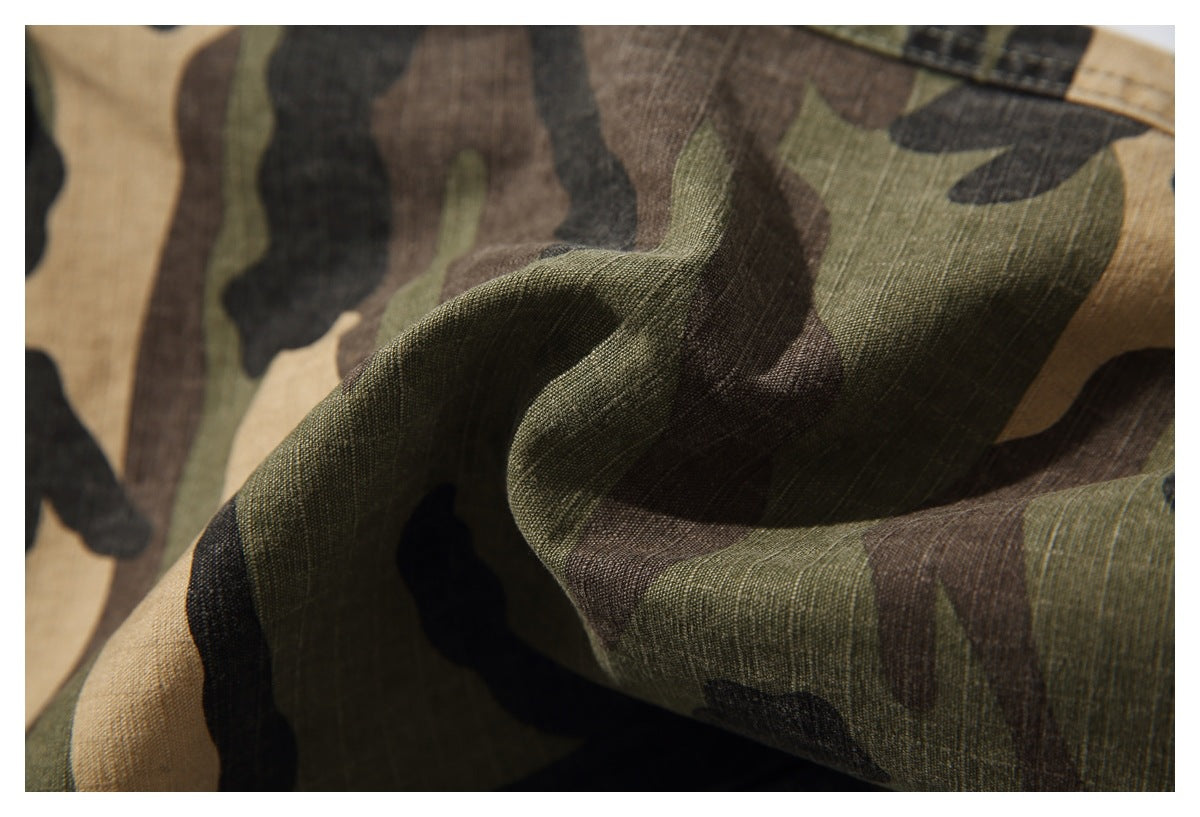 Close-up of the olive, tan, brown, and black camouflage pattern and fabric texture.