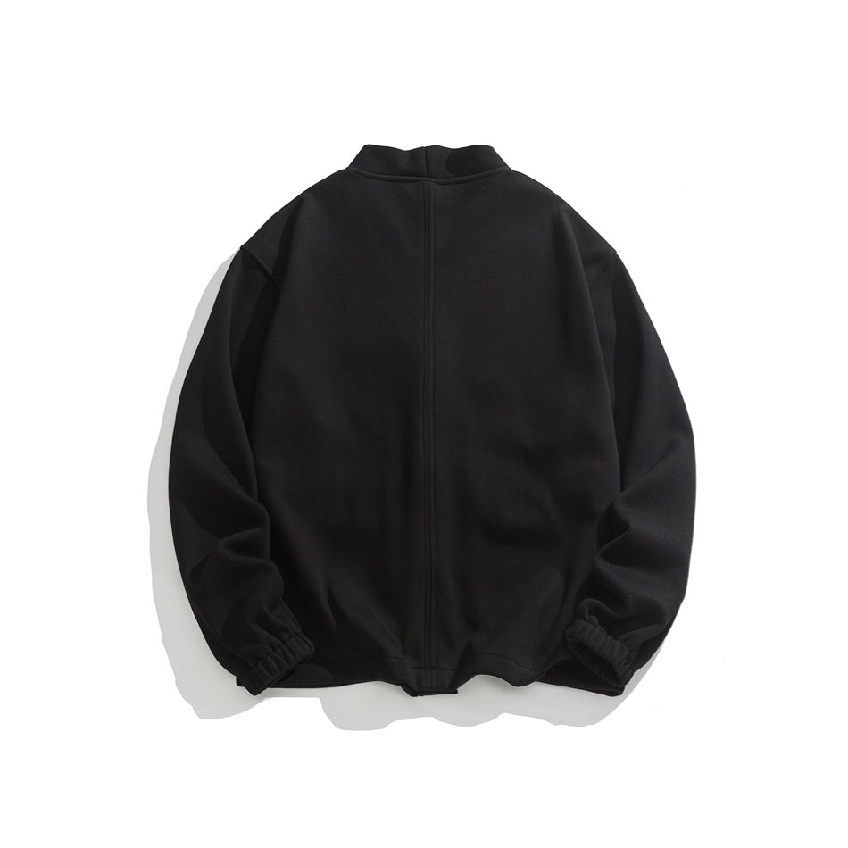 Back view of a black jacket with a stand collar, center seam, and elastic cuffs.