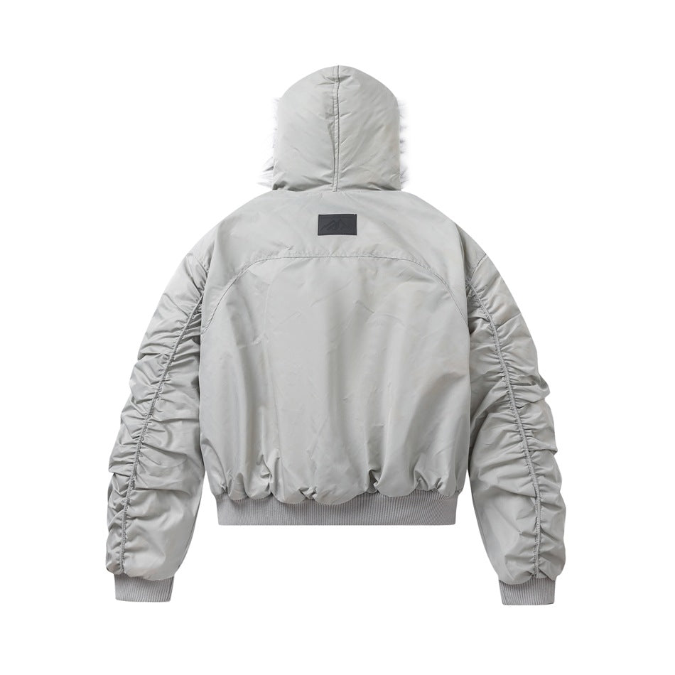 Back view of a light gray hooded jacket with gathered sleeves and ribbed cuffs and hem.